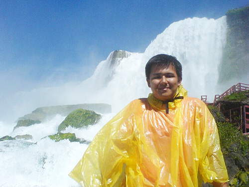 Posing in front of one of the falls at Niagara Falls, USA.